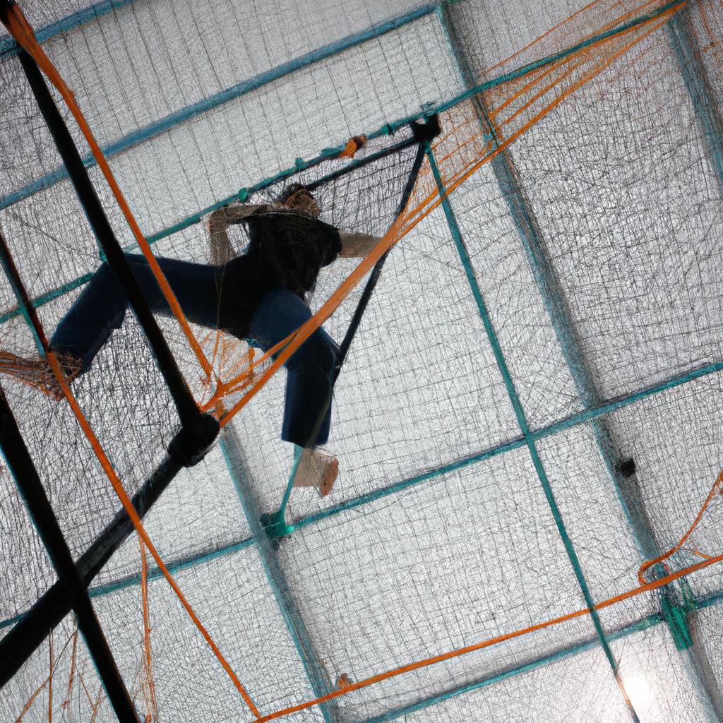 Person climbing cargo net indoors
